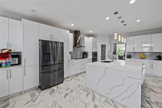 12404 Pine Valley Cir, Peyton, CO 80831 - kitchen featuring stainless steel fridge with ice dispenser, wall chimney range hood, modern cabinets, recessed lighting, and black electric stovetop