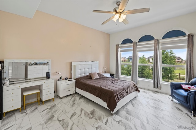 12404 Pine Valley Cir, Peyton, CO 80831 - bedroom with light marble finish floors and ceiling fan
