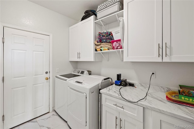 12404 Pine Valley Cir, Peyton, CO 80831 - laundry area with cabinet space, light marble finish flooring, and separate washer and dryer