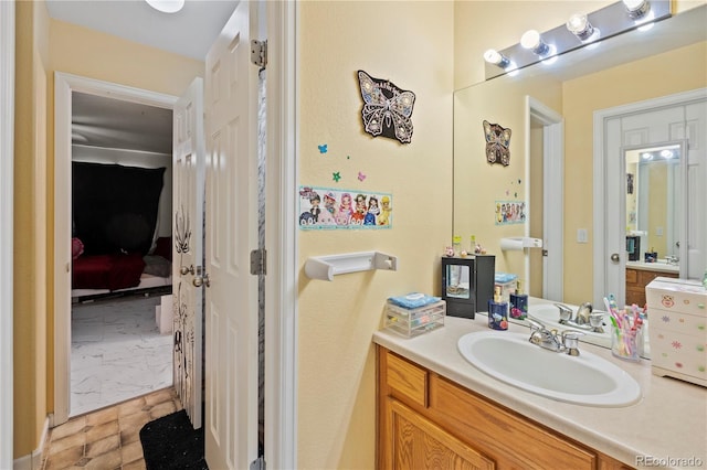 12404 Pine Valley Cir, Peyton, CO 80831 - bathroom featuring vanity and ensuite bath