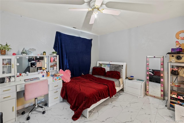 12404 Pine Valley Cir, Peyton, CO 80831 - bedroom featuring light marble finish floors, an office area, and a ceiling fan