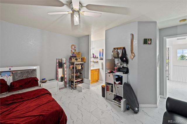 12404 Pine Valley Cir, Peyton, CO 80831 - bedroom featuring light marble finish flooring, ensuite bath, and a ceiling fan