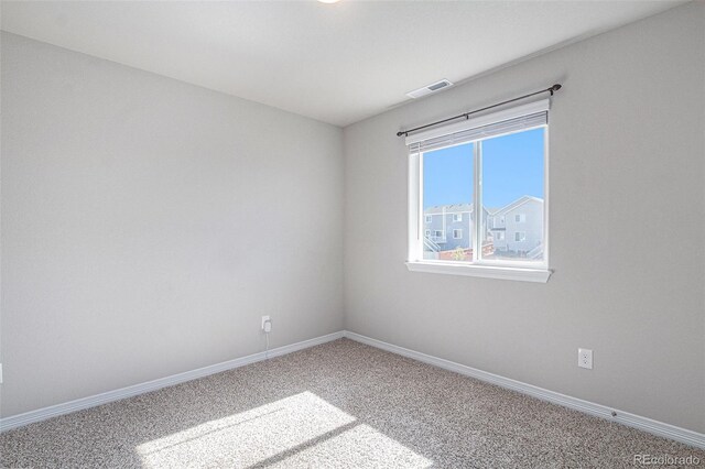 unfurnished room featuring carpet floors