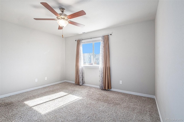 empty room with carpet flooring and ceiling fan