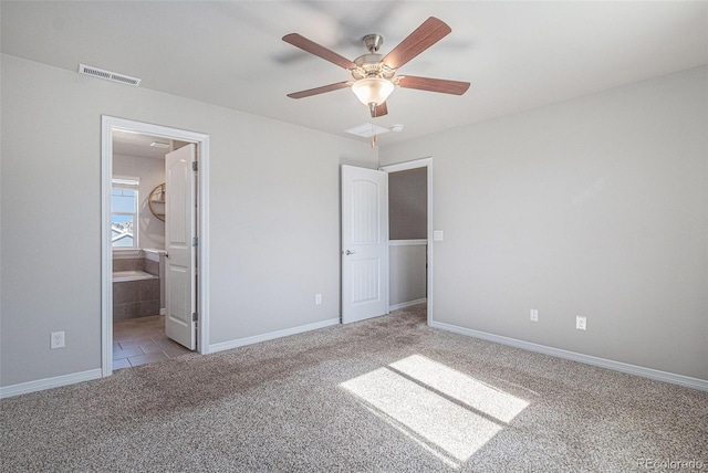 unfurnished bedroom with light carpet, connected bathroom, and ceiling fan