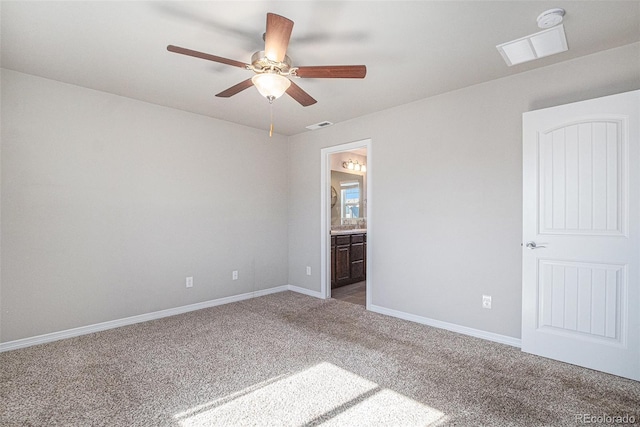 carpeted spare room featuring ceiling fan