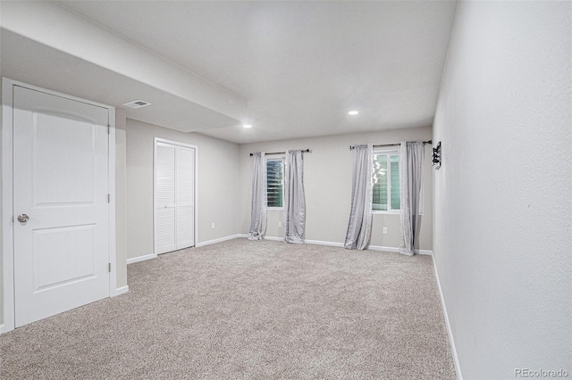 empty room with carpet flooring