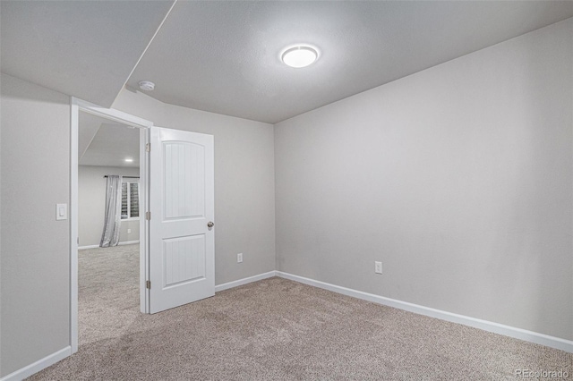 empty room featuring carpet flooring