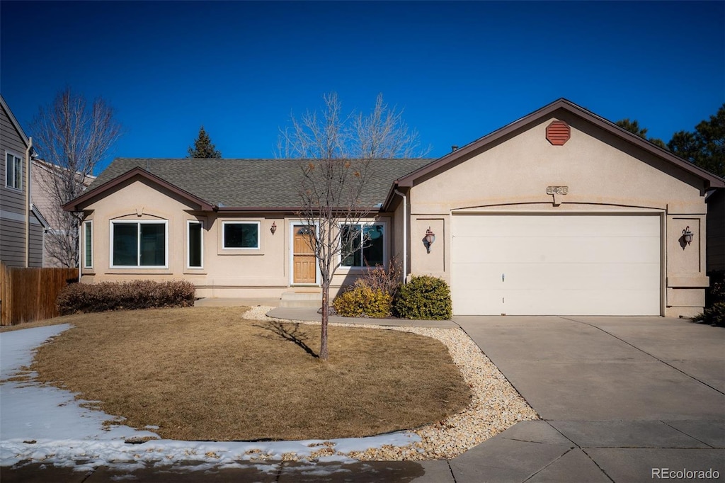 ranch-style home featuring a garage