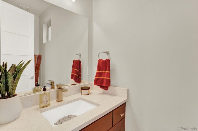 bathroom featuring visible vents and vanity