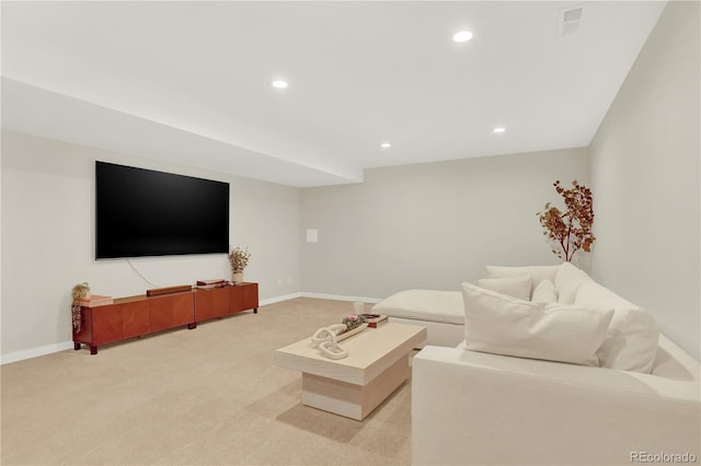 living room featuring light carpet, recessed lighting, and baseboards