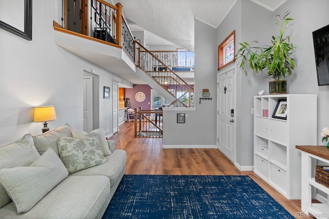 8544 S Upham Way, Littleton, CO 80128 - entrance foyer featuring wood finished floors, a towering ceiling, and stairway