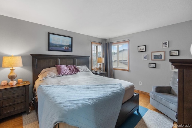 8544 S Upham Way, Littleton, CO 80128 - bedroom featuring wood finished floors and baseboards