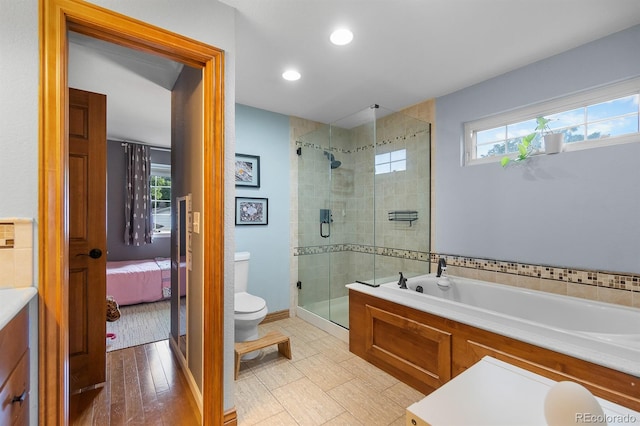 8544 S Upham Way, Littleton, CO 80128 - bathroom featuring a garden tub, a shower stall, connected bathroom, and recessed lighting