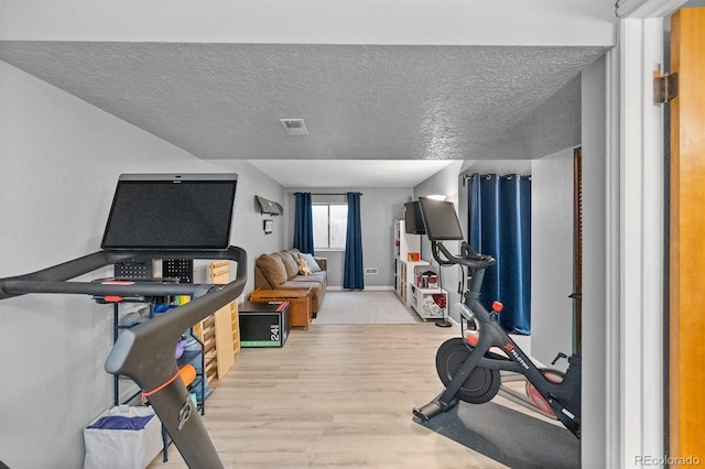 8544 S Upham Way, Littleton, CO 80128 - exercise room with wood finished floors and a textured ceiling