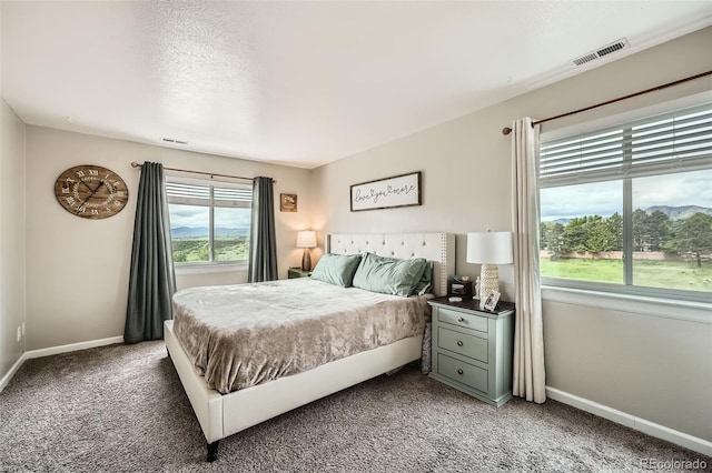 10872 W Evans Ave Unit 3D, Lakewood, CO 80227 - bedroom featuring light carpet and baseboards
