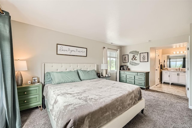 10872 W Evans Ave Unit 3D, Lakewood, CO 80227 - bedroom with carpet floors, a sink, and connected bathroom