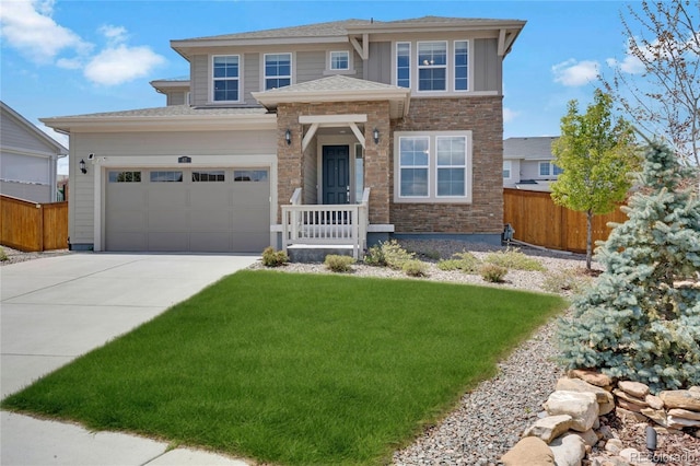 prairie-style home featuring driveway, stone siding, and an attached garage