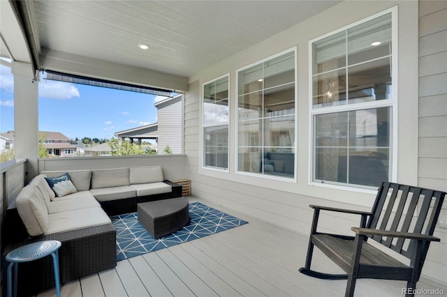 wooden deck featuring an outdoor hangout area