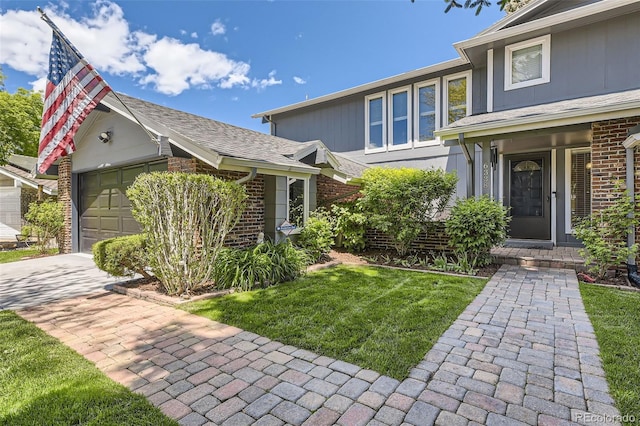 6338 S Oneida Ct, Centennial, CO 80111 - view of front of home with brick siding, a garage, a front yard, and driveway