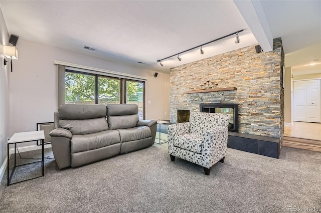 6338 S Oneida Ct, Centennial, CO 80111 - living room with rail lighting, carpet flooring, a fireplace, and baseboards