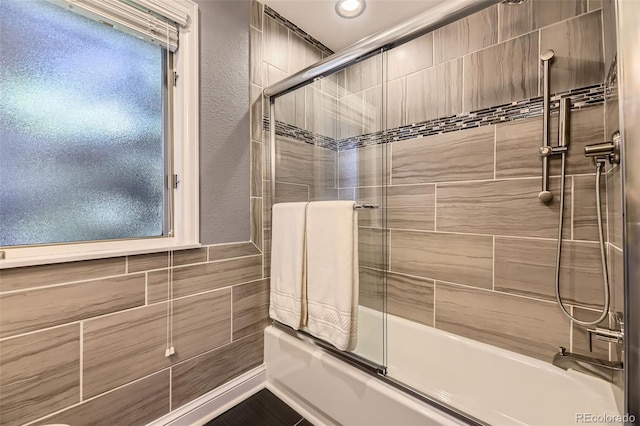 6338 S Oneida Ct, Centennial, CO 80111 - bathroom with shower / bath combination with glass door and tile walls