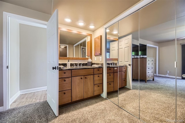 6338 S Oneida Ct, Centennial, CO 80111 - bathroom with vanity, baseboards, recessed lighting, and carpet floors