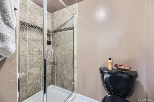 6338 S Oneida Ct, Centennial, CO 80111 - bathroom with baseboards and a shower stall
