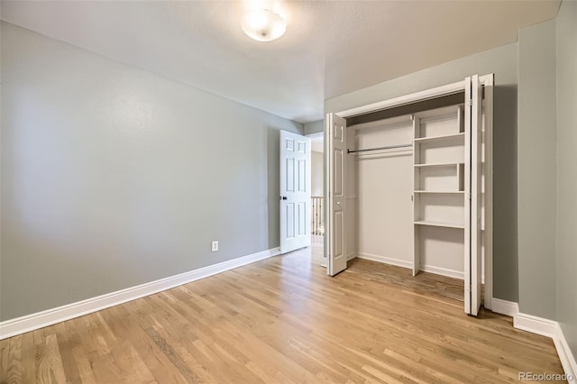 6338 S Oneida Ct, Centennial, CO 80111 - unfurnished bedroom featuring light wood-style floors, baseboards, and a closet