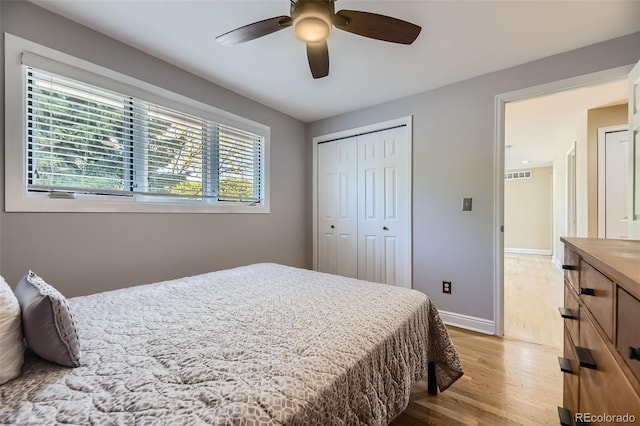 6338 S Oneida Ct, Centennial, CO 80111 - bedroom featuring light wood-style floors, baseboards, a closet, and ceiling fan