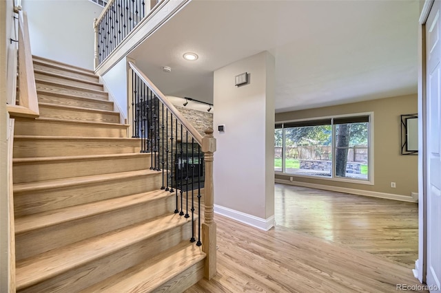 6338 S Oneida Ct, Centennial, CO 80111 - stairway with baseboards and wood finished floors