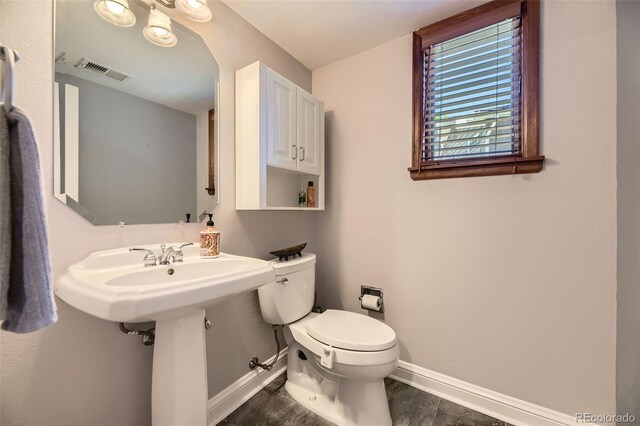 6338 S Oneida Ct, Centennial, CO 80111 - bathroom with baseboards and toilet