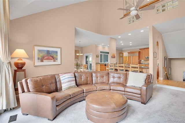 29433 Firethorne Ct, Evergreen, CO 80439 - living area featuring ceiling fan, light carpet, recessed lighting, crown molding, and a high ceiling