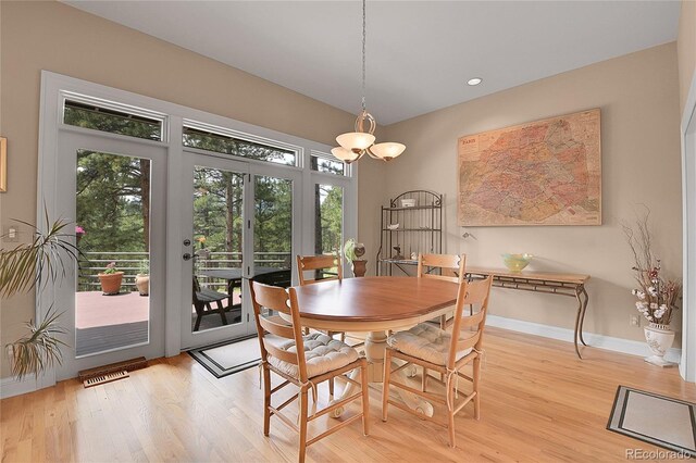 29433 Firethorne Ct, Evergreen, CO 80439 - dining space featuring light wood-style floors, french doors, baseboards, and recessed lighting