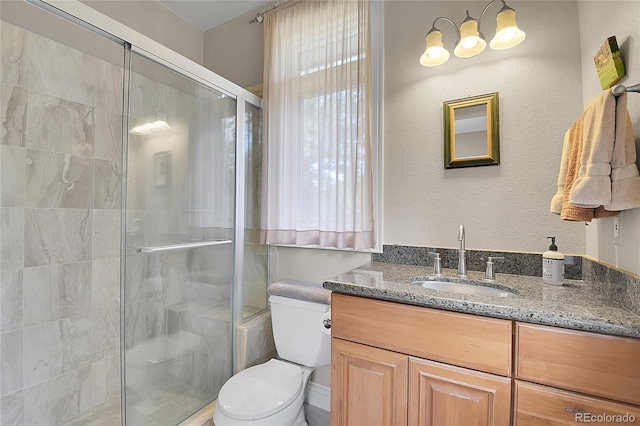 29433 Firethorne Ct, Evergreen, CO 80439 - bathroom with toilet, vanity, and a shower stall