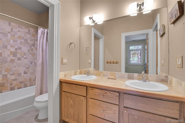 29433 Firethorne Ct, Evergreen, CO 80439 - bathroom featuring double vanity, toilet, shower / bathtub combination with curtain, and tile patterned flooring