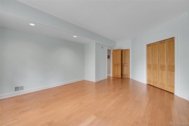 29433 Firethorne Ct, Evergreen, CO 80439 - unfurnished bedroom featuring light wood finished floors, recessed lighting, baseboards, and a closet