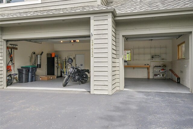 29433 Firethorne Ct, Evergreen, CO 80439 - garage featuring a central vacuum unit and a garage door opener