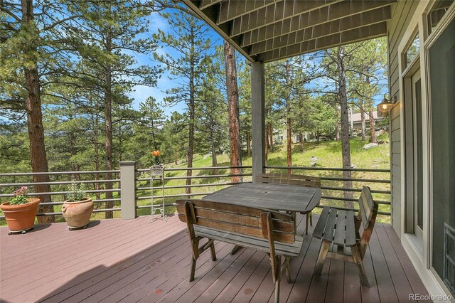 29433 Firethorne Ct, Evergreen, CO 80439 - wooden terrace with view of scattered trees
