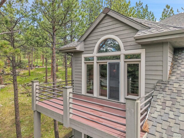29433 Firethorne Ct, Evergreen, CO 80439 - view of property exterior featuring roof with shingles