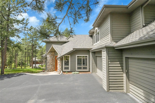 29433 Firethorne Ct, Evergreen, CO 80439 - view of home's exterior with roof with shingles