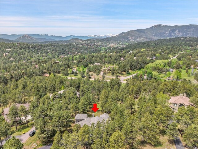29433 Firethorne Ct, Evergreen, CO 80439 - aerial view of property's location with a mountain backdrop and a forest