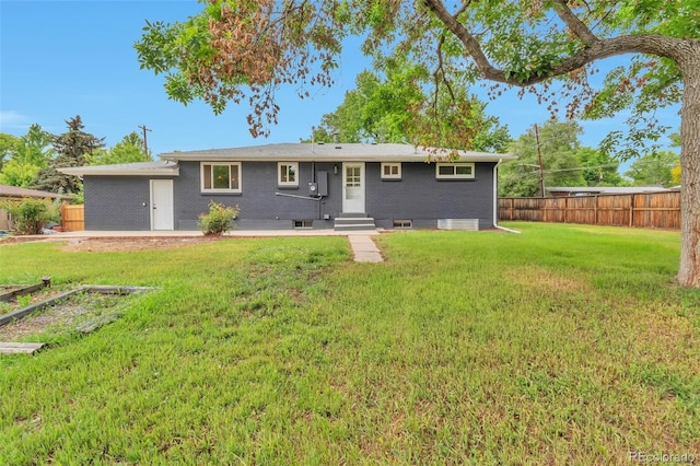 2598 Teller St, Lakewood, CO 80214 - back of house featuring entry steps and brick siding