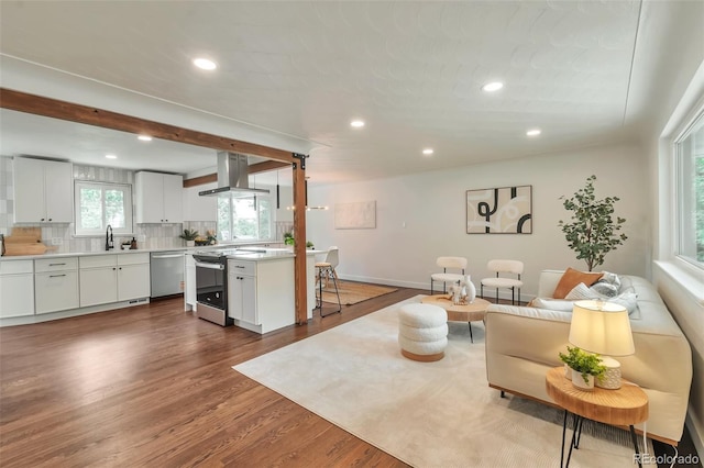 2598 Teller St, Lakewood, CO 80214 - living room with recessed lighting, dark wood-style floors, and baseboards