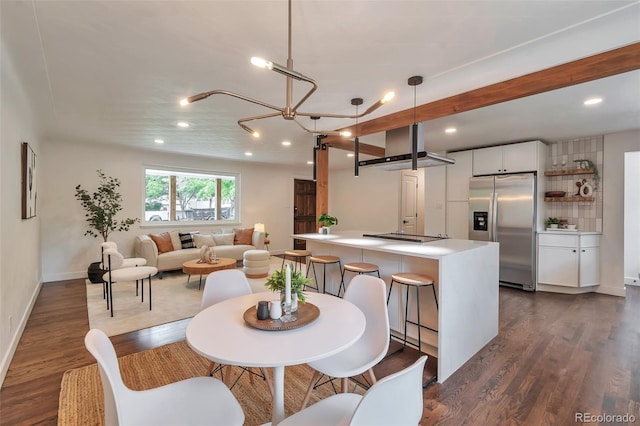 2598 Teller St, Lakewood, CO 80214 - dining room with dark wood finished floors, recessed lighting, baseboards, and a chandelier