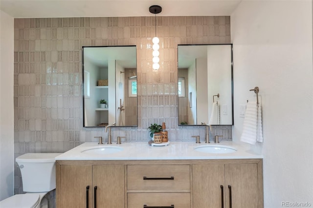 2598 Teller St, Lakewood, CO 80214 - bathroom with double vanity and toilet