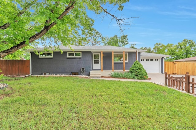 2598 Teller St, Lakewood, CO 80214 - single story home with an attached garage, driveway, and brick siding