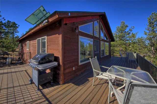 wooden terrace featuring grilling area