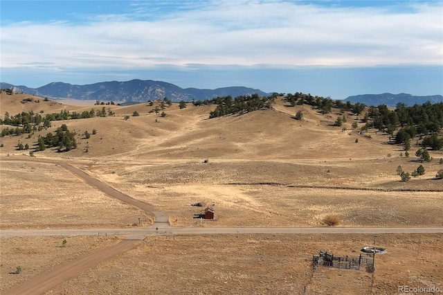 view of mountain feature with a rural view