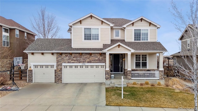 craftsman-style house with stone siding, a shingled roof, a porch, and driveway